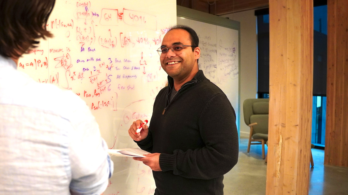 Doing awesome math at a white board with a colleague